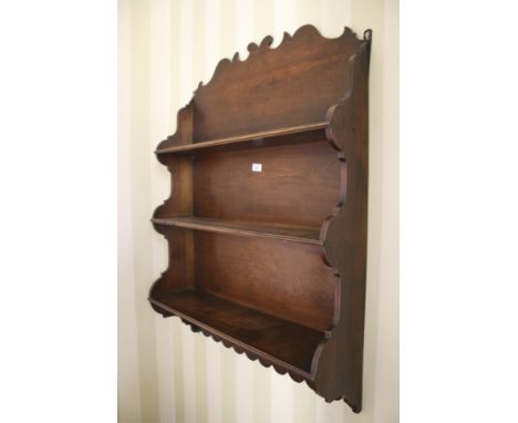 A 19th century stained walnut waterfall three tier shelf, 110 H, 74cm W, 19cm D