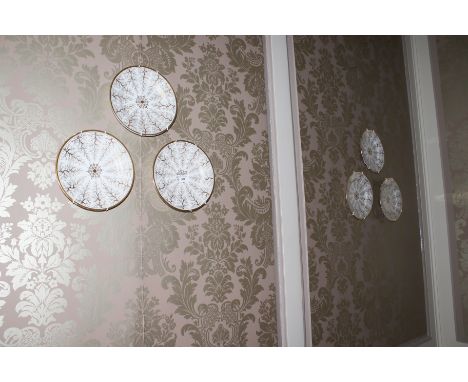 A set of six 19th century gilt and white Worcester style wall plates 