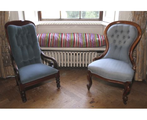 Two Victorian low mahogany chairs. One with low scroll arms and turned legs, the other a nursing chair with carved cabriole s