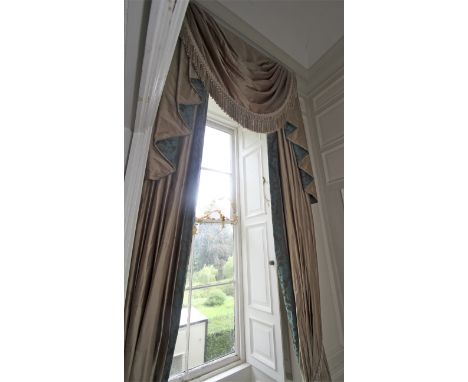 A pair of damask silk lined curtains and matching tasselled pelmet. The fabric decorated with a turquoise and brown print, cr