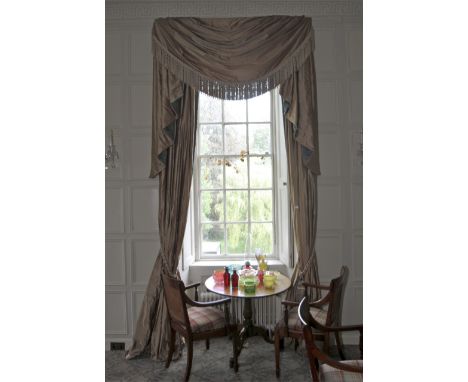 A pair of damask silk lined curtains and matching tasselled pelmet. The fabric decorated with a turquoise and brown print, cr
