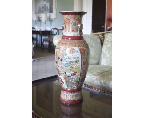 A tall 20th century Oriental vase. With applied enamel decoration and decorative figures in the garden, 61cm H.