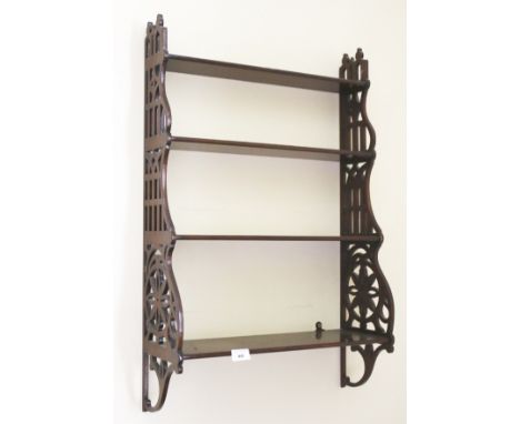 An early 20th century mahogany fretted wall shelf of four shelves, 79cm H, 51cm W, 19cm D 