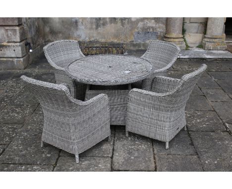 A set of rattan garden furniture comprising table and four chairs