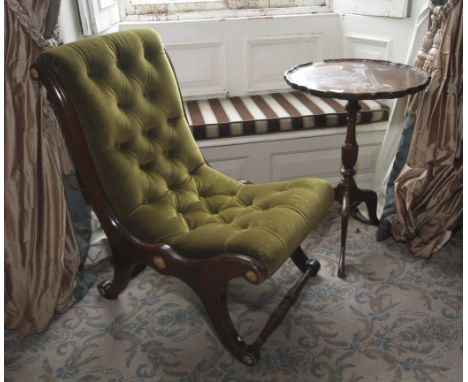 A 20th century mahogany piecrust tripod table and a green velvet button back slipper chair. Brass rosettes, etc.
