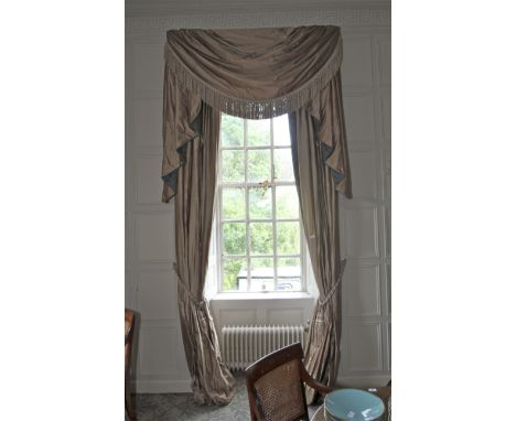 A pair of damask silk lined curtains and matching tasselled pelmet. The fabric decorated with a turquoise and brown print, cr