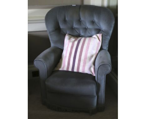 An early to mid 20th century button back upholstered armchair with pale blue covering 