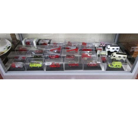 Shelf of model fire engines etc