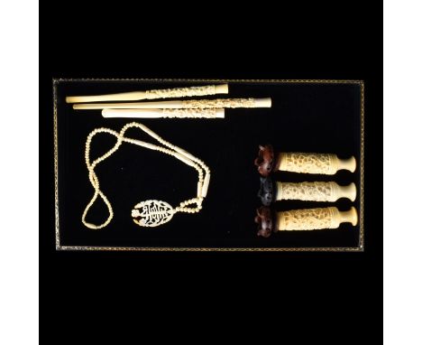 Grouping of Seven (7) Oriental Carved Ivory Items. Includes: 3 vases, 3 cigarette holders, and a necklace. Largest cigarette 