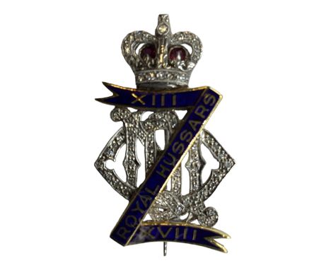 An 18ct white gold diamond ruby and enamel regimental sweethearts brooch for Royal Hussars, set throughout with single cut di