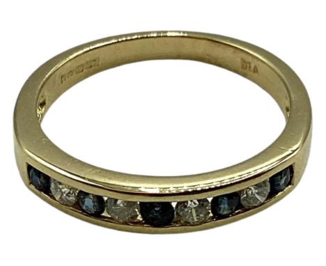 An 18ct gold sapphire and diamond ring. Channel set alternating brilliant  cut diamonds and sapphires. Size K. 2.9g 
