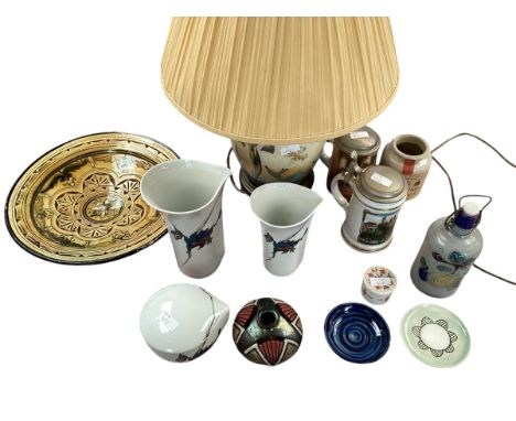 A collection of ceramic items to include a Arabic style charger, two modern printed Steins, three pieces of Kaiser style porc