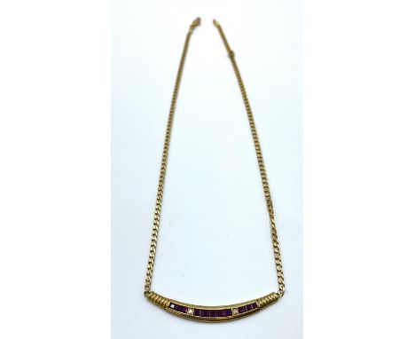 A 14ct gold flat fancy link necklace with integral ruby set pendant 8.8 g, 39 cm