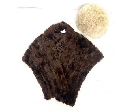 A light coloured fur hat (minor losses), and a brown fur shawl with collar