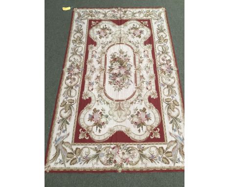 Two rugs: Tapestry style rug, beige with brown borders and centred  flower medallion 150cm x 242 cm; and Tapestry style rug, 