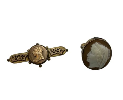 An unmarked yellow metal cameo ring together with an Etruscan style yellow metal brooch. 