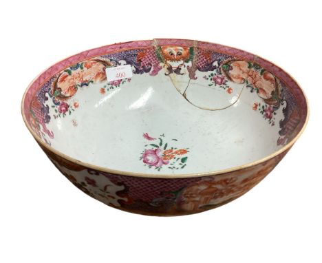 An Oriental ceramic bowl with hand painted panels of landscape scenes , stylised lions heads and floral decoration (AF) 26cm 
