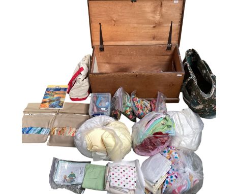 A good quantity of SEWING ACCESSORIES, to include a wooden trunk with bags and boxes of zips, cottons, large quantities of co