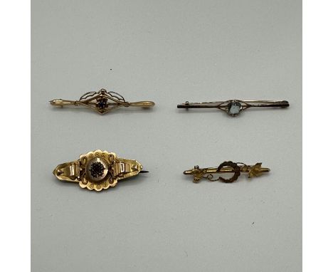 Four 9ct gold bar brooches. One set with ruby and pearl and another aquamarine set. 6.6g 