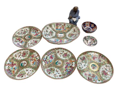 A collection of Oriental ceramic items to include a set of famille rose plates and four lobed dish together with two small bo
