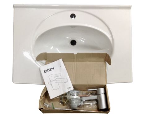 A ceramic oversized sink with an Ensen mixer tap.