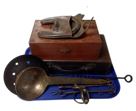 A tray containing two vintage wooden table boxes, a horseshoe in leather case, a horse bit together with a copper ladle and a