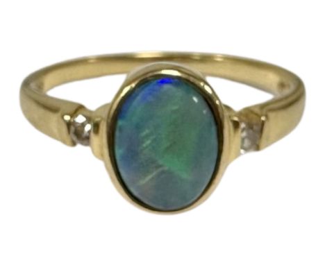 An 18ct gold opal and diamond ring, size N.  CONDITION REPORT: 3.2g