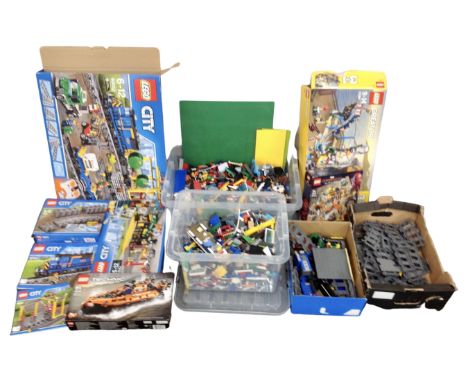 A large quantity of LEGO including LEGO City 60052 train set, 7499 train pack, 60154 bus stop and news stand, LEGO Technic 42