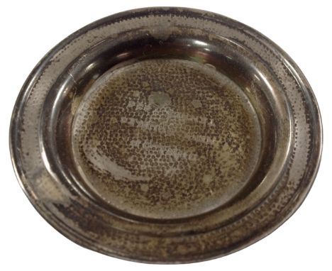 A silver dish inscribed Dunlop Men's Tennis Doubles 1936. (diameter 7.5cm)