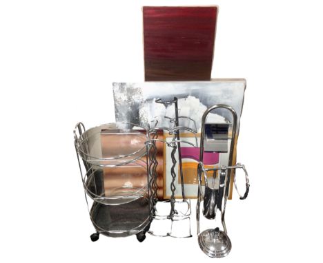 A contemporary metal and glass three tier trolley together with two further metal wine racks, a towel rail, a bathroom stand,