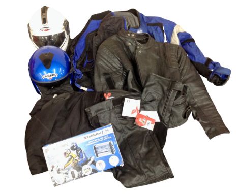 A box containing motorcycle helmets, a Starcom motorcycle helmet system together with assorted motorcycle clothing.