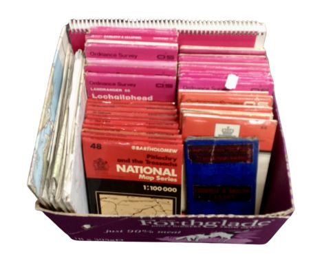 A box containing Ordnance Survey and Bartholomew folded maps.