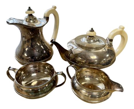 A silver four piece tea service, Henry Atkin, Sheffield 1937, 1738.2g. (4) CONDITION REPORT: This silver and ivory-handled te