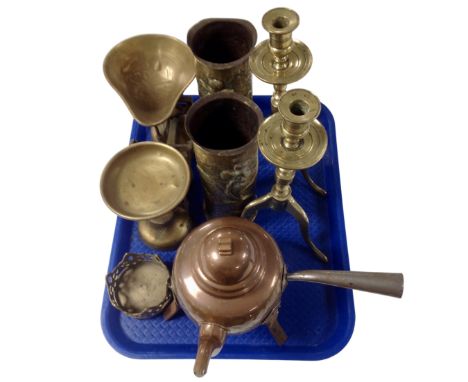 A tray containing antique and later metalware including two trench art ammunition casings, a pair of brass candlesticks, a co