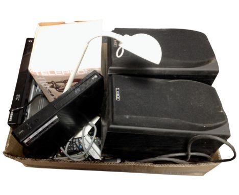 A box containing LG and Samsung 3D and blu-ray players, a retro style telephone, angle poise lamp, a pair of Mission speakers