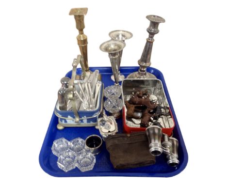 A tray containing assorted plated wares, opera glasses, mid-20th century metal horse figures, a brass candlestick etc.