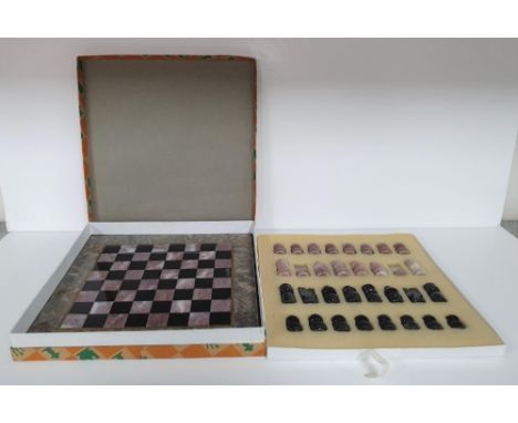 Fine quality, complete (32 pieces) onyx carved chess set and onyx board in its original box 