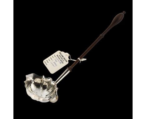 A George III silver toddy ladle, with finely turned rosewood handle, by S Adams, hallmarks London 1767, length 29cmHandle ter