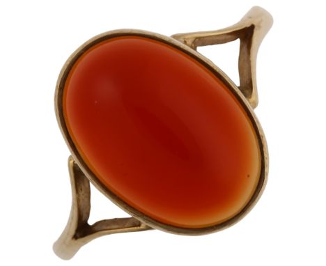 A late 20th century 9ct gold carnelian dress ring, set with oval cabochon carnelian, hallmarks Birmingham 1978, setting heigh