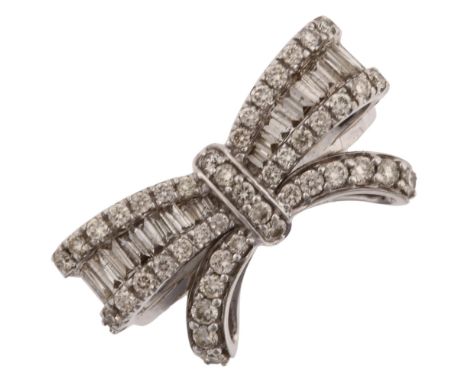 A modern 9ct white gold diamond ribbon bow ring, set with modern round brilliant and baguette-cut diamonds, total diamond con