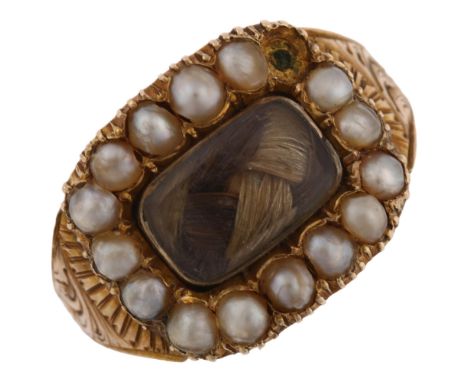 A Georgian pearl and hairwork mourning ring, gold closed-back settings with plaited hair beneath convex bevel-edge glass pane