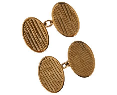 A pair of Art Deco 9ct gold cufflinks, oval panels with engine turned decoration, maker's marks EAP, hallmarks Birmingham 193