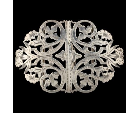 A late Victorian silver nurse's buckle, pierced and engraved floral decoration by Reynolds & Westwood, hallmarks Birmingham 1