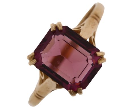 A late 20th century 9ct gold amethyst dress ring, set with emerald step-cut amethyst, hallmarks Birmingham 1977, setting heig