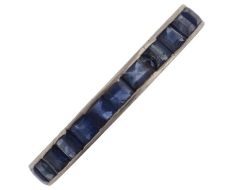 A sapphire full eternity ring, unmarked white metal settings, set with calibre-cut sapphires, band width 2.8mm, size O, 2.3gA