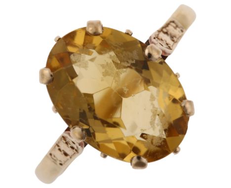 A late 20th century 9ct gold citrine dress ring, set with oval mixed-cut citrine, hallmarks Birmingham 1973, setting height 1