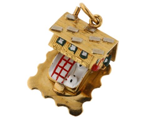 A Continental 18ct gold and enamel kinetic chalet charm, opening to reveal couple in bed, charm length 13.3mm, 5.2gNo damage 