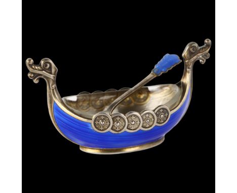 THEODOR OLSENS EFTL - a Norwegian silver-gilt blue enamel Viking boat salt cellar, with dragon-head handles, length 8cm, with