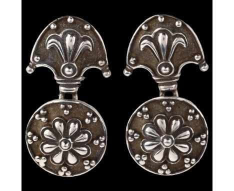 A pair of late 20th century silver drop earrings, with relief embossed decoration, maker's marks AJ, import hallmarks Sheffie