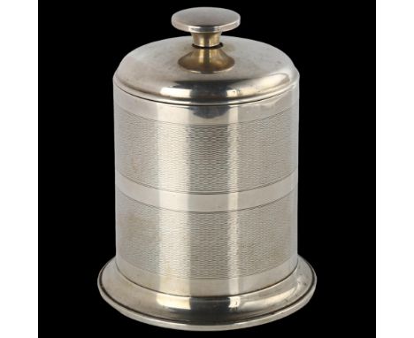 An Art Deco George V silver table cigarette dispenser, allover engine turned decoration with segmented interior, patent no. 3